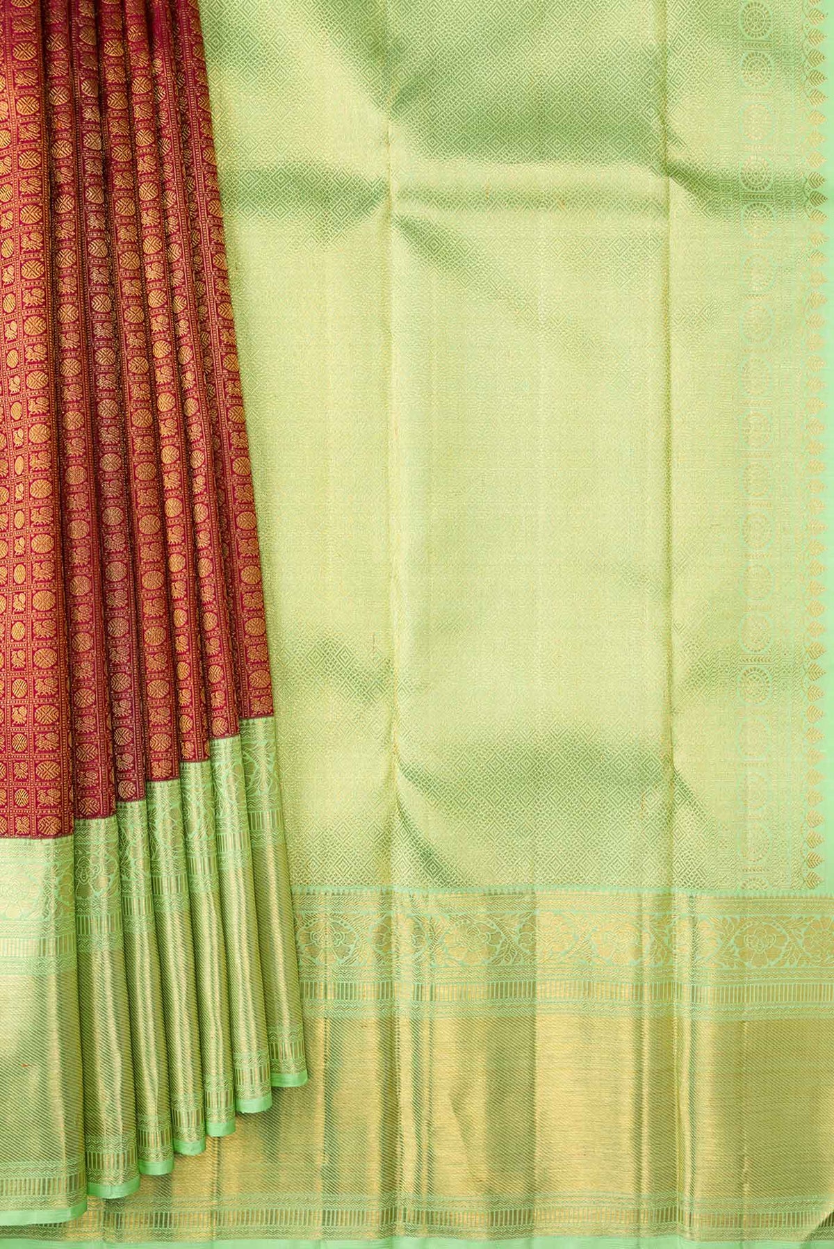 Pleats and pallu of Maroon Dual Tone Kanchipuram Silk Saree with Zari Brocade on the body and Zari Border