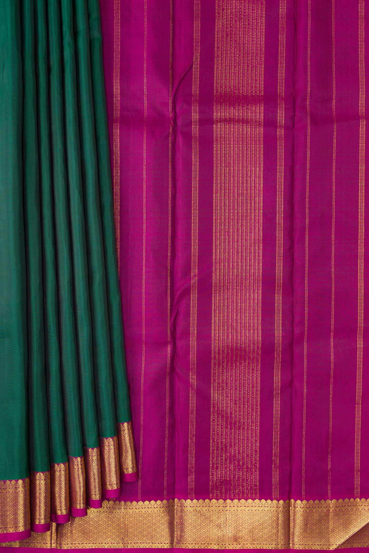 Pleats and pallu of Bottle Green Dual Tone Kanchipuram Silk Saree with Plain Body and Zari Border. 