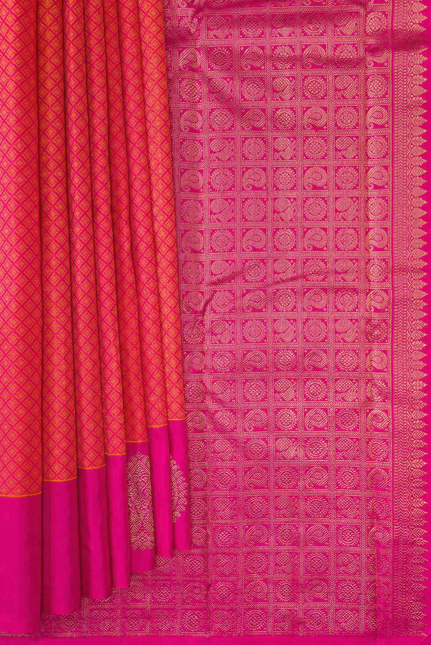 Pleats and pallu of Orange Dual Tone Kanjivaram Silk Saree with Jacquard design on the body and Fancy Border. 