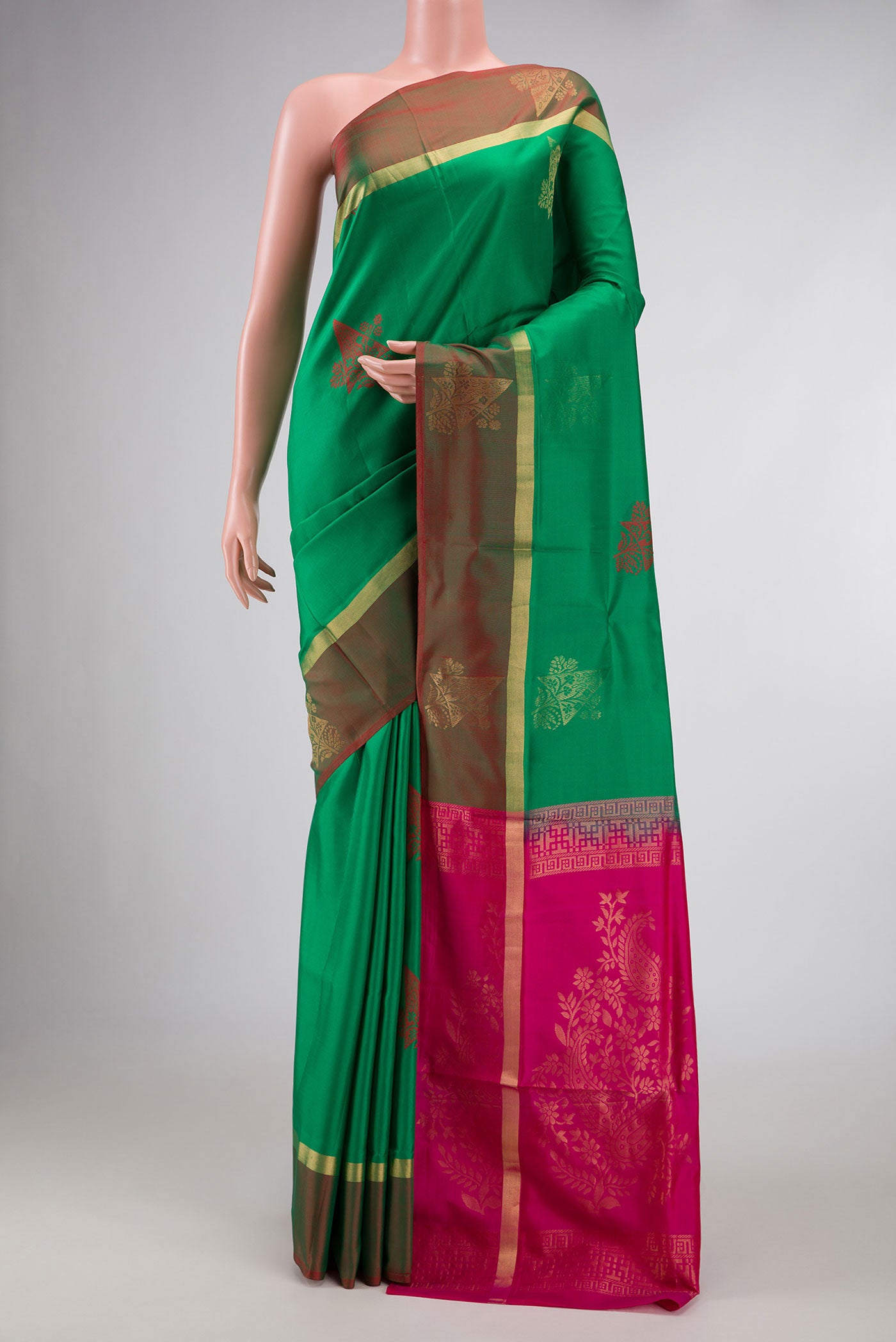 Green Dual Tone Soft Silk Saree with Zari And Thread Butta on the body and Zari Border displayed on a mannequin