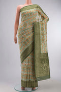 Off White Banarasi Georgette Saree with Printed design on the body and Zari Border displayed on a mannequin
