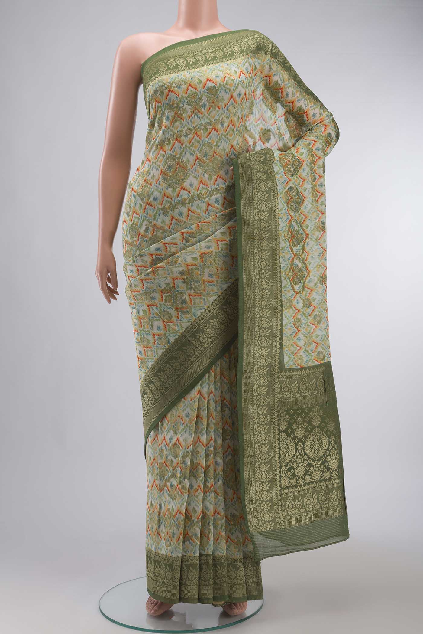 Off White Banarasi Georgette Saree with Printed design on the body and Zari Border displayed on a mannequin