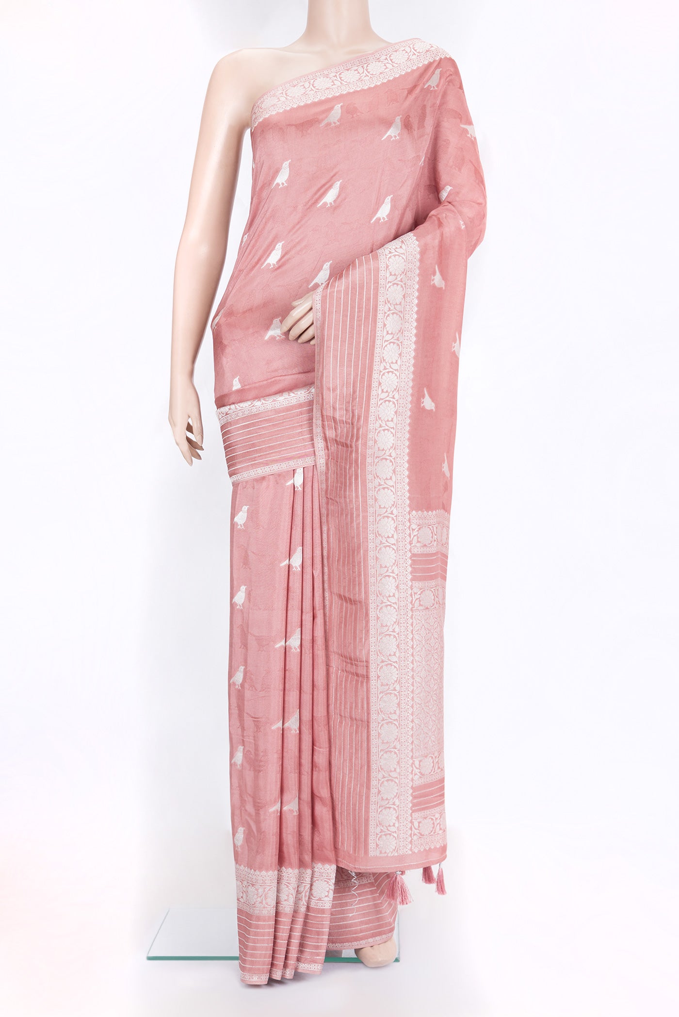 Rose Gold Blended Banarasi Silk Saree with Zari Butta on the body and Fancy Border.  displayed on a mannequin