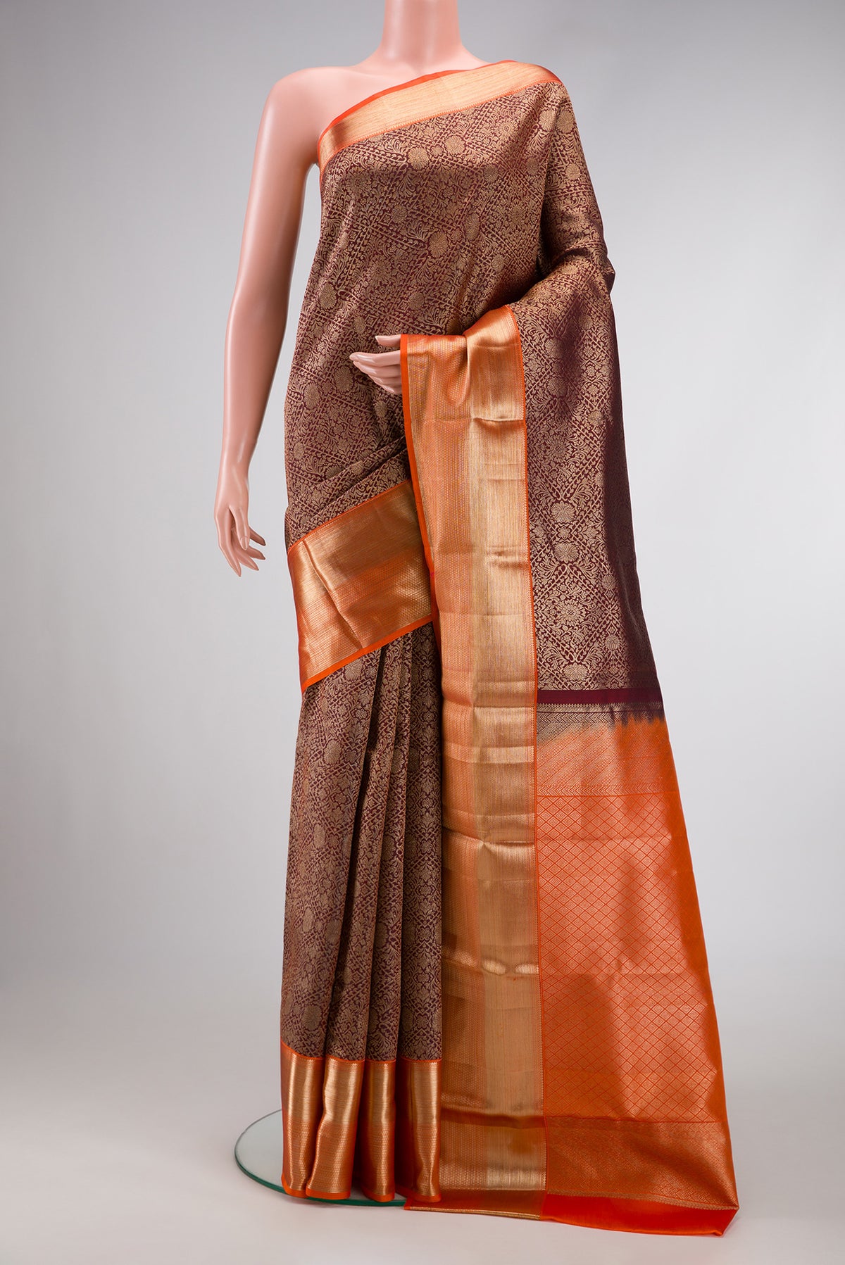 Maroon Dual Tone Kanchipuram Silk Saree with Zari Brocade on the body and Zari Border.  displayed on a mannequin