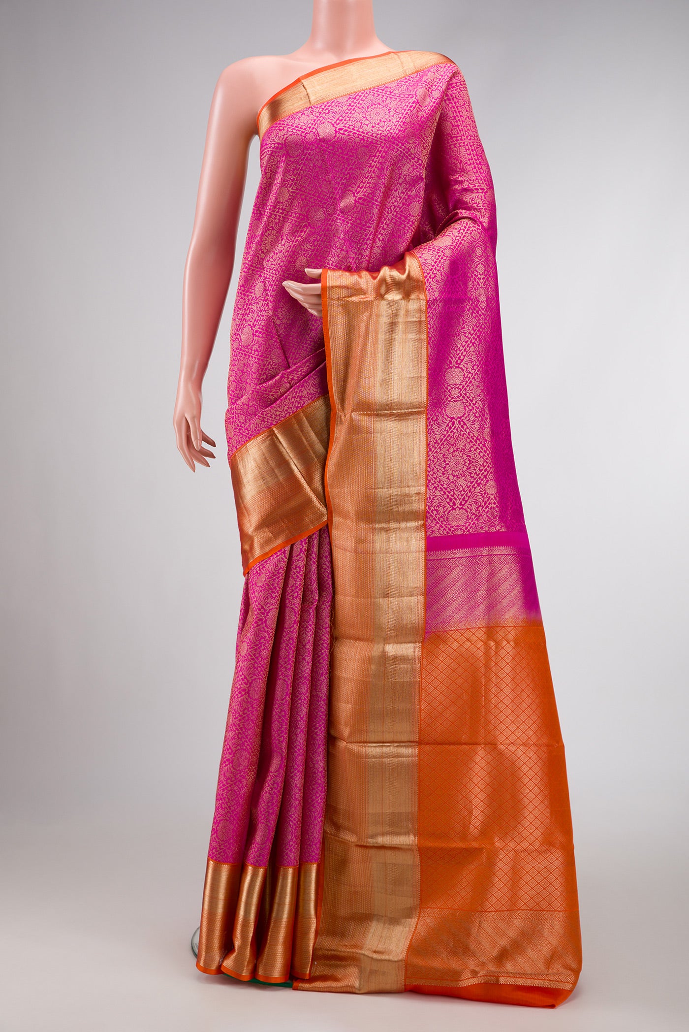 Pink Dual Tone Kanchipuram Silk Saree with Zari Brocade on the body and Zari Border.  displayed on a mannequin