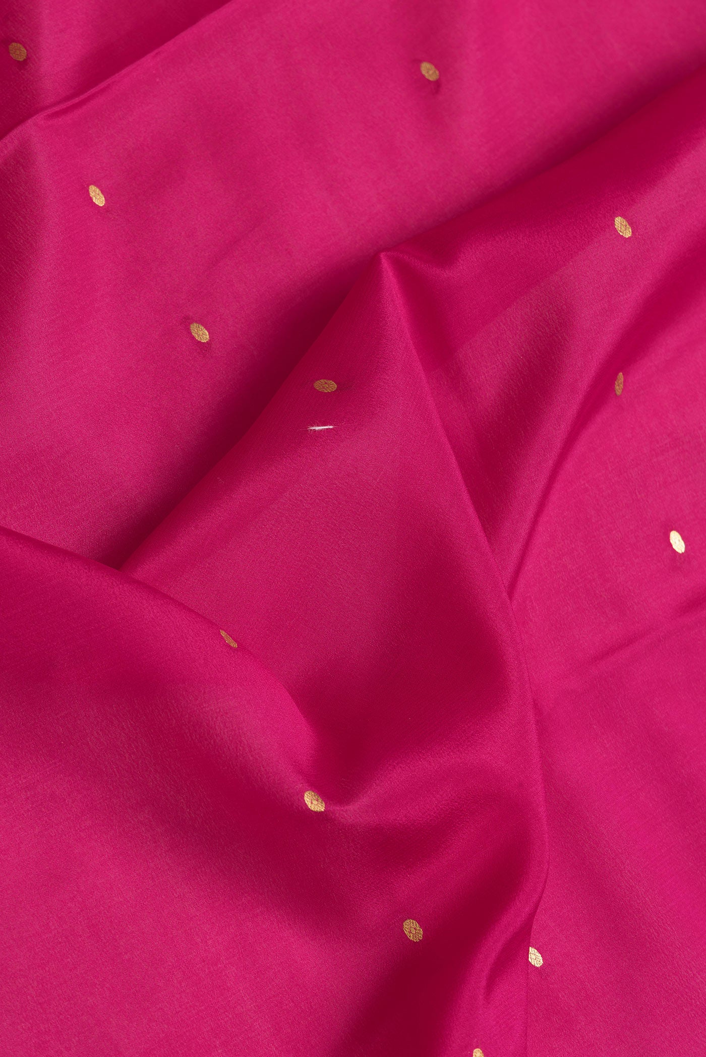 Close up of Magenta Dual Tone Mysore Silk Saree with Zari Butta on the body and Zari Border.  displaying folds