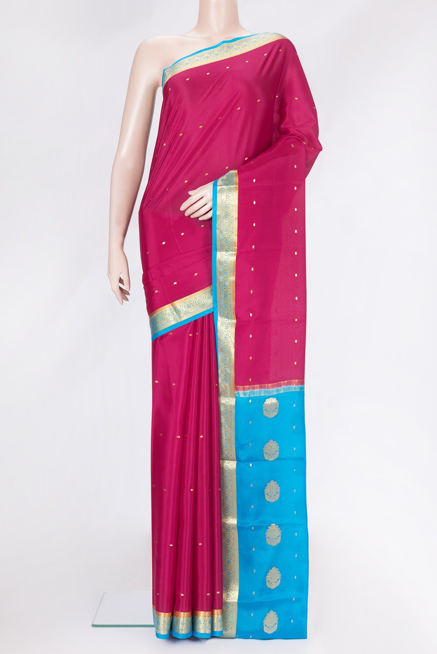 Magenta Dual Tone Mysore Silk Saree with Zari Butta on the body and Zari Border.  displayed on a mannequin