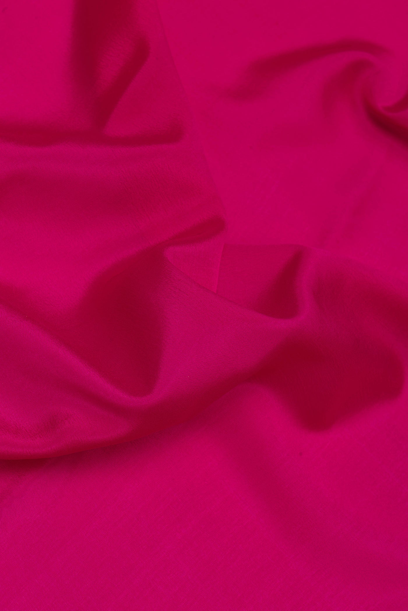 Close up of Magenta Mysore Silk Saree with Plain Body and Zari Border.  displaying folds