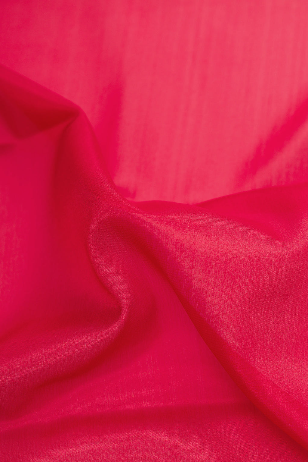 Close up of Maroon Dual Tone Mysore Crepe Saree with Plain Body and Zari Border.  displaying folds