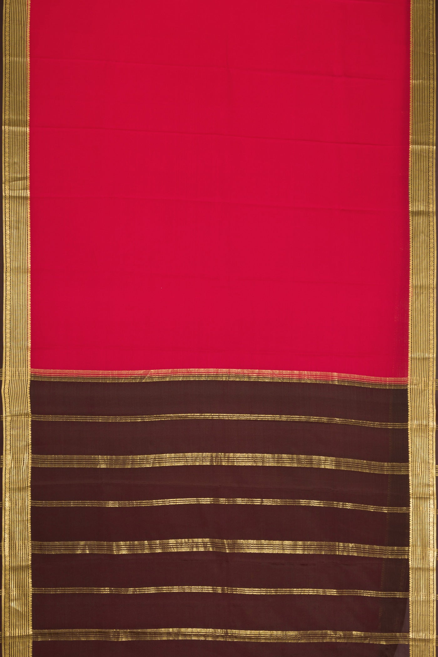 Maroon Dual Tone Mysore Crepe Saree with Plain Body and Zari Border.  displayed on a mannequin