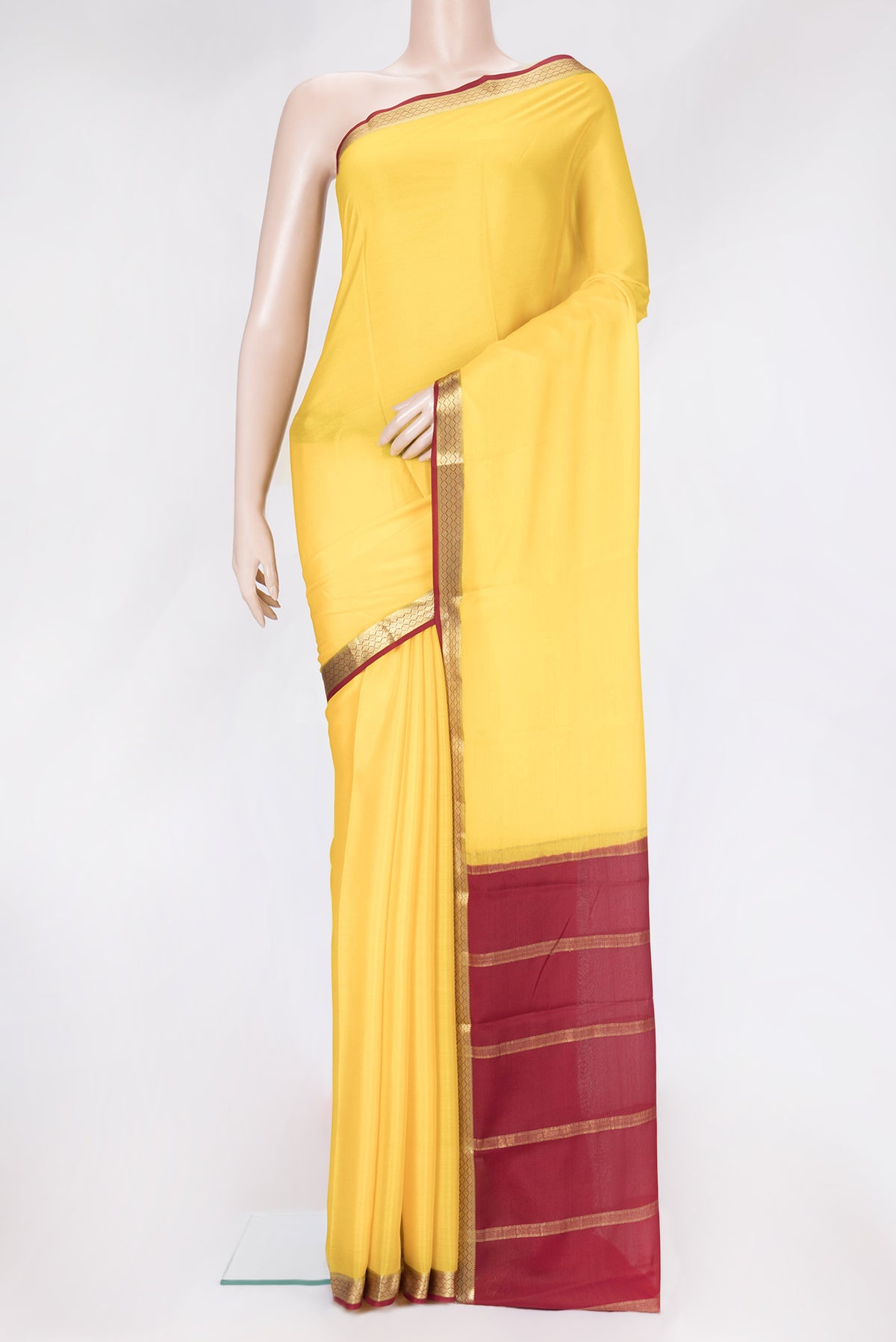 Yellow Dual Tone Mysore Silk Saree with Plain Body and Zari Border.  displayed on a mannequin