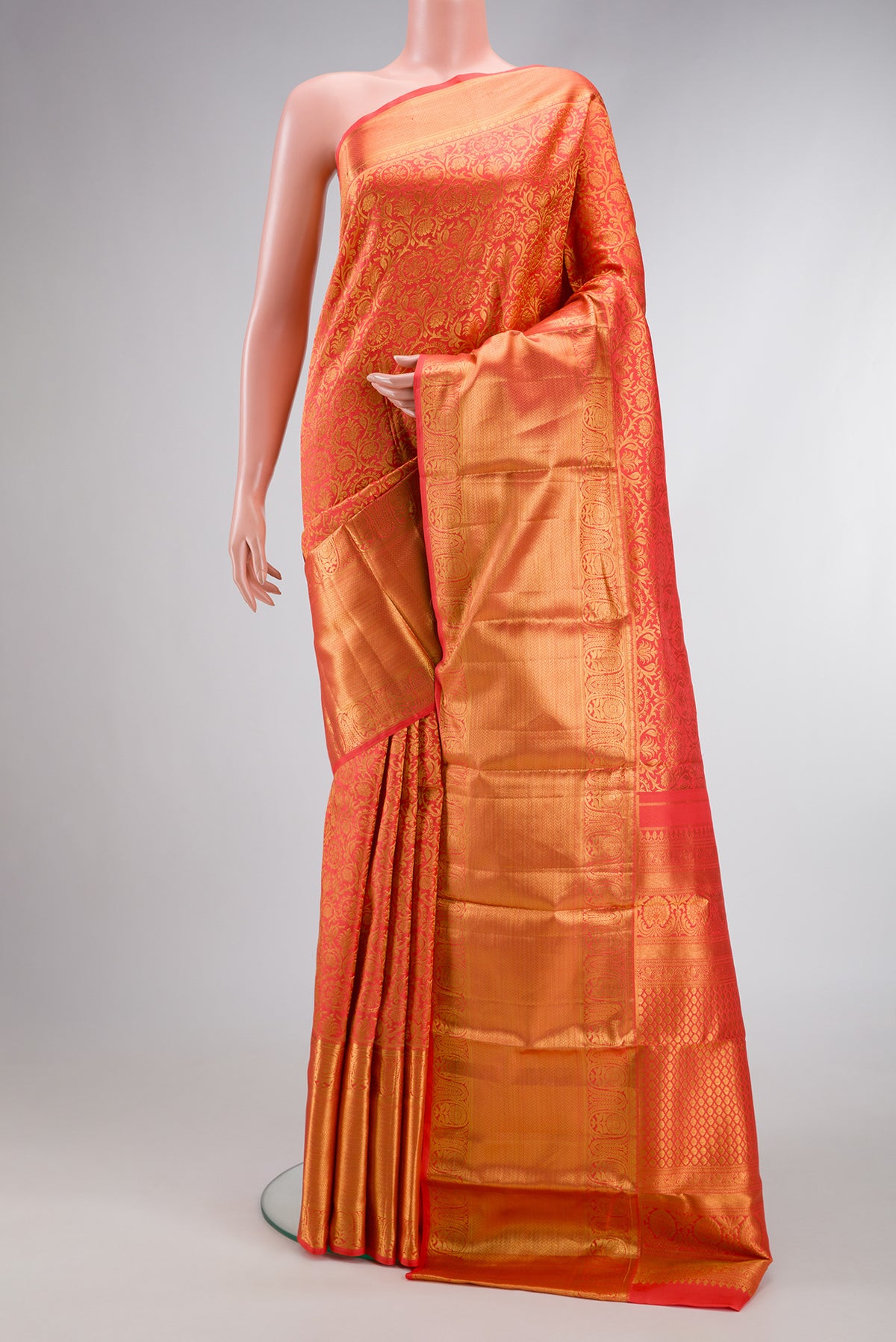 Coral Dual Tone Kanjivaram Silk Saree with Zari Brocade on the body and Zari Border.  displayed on a mannequin