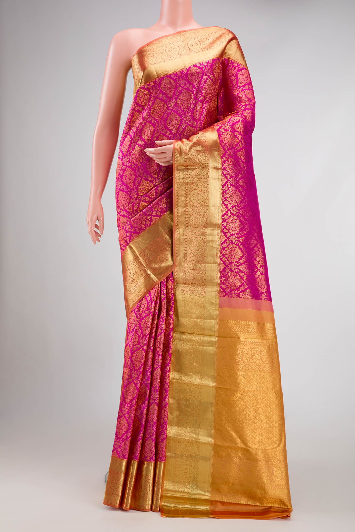 Pink Dual Tone Kanjivaram Silk Saree with Zari Brocade on the body and Zari Border.  displayed on a mannequin