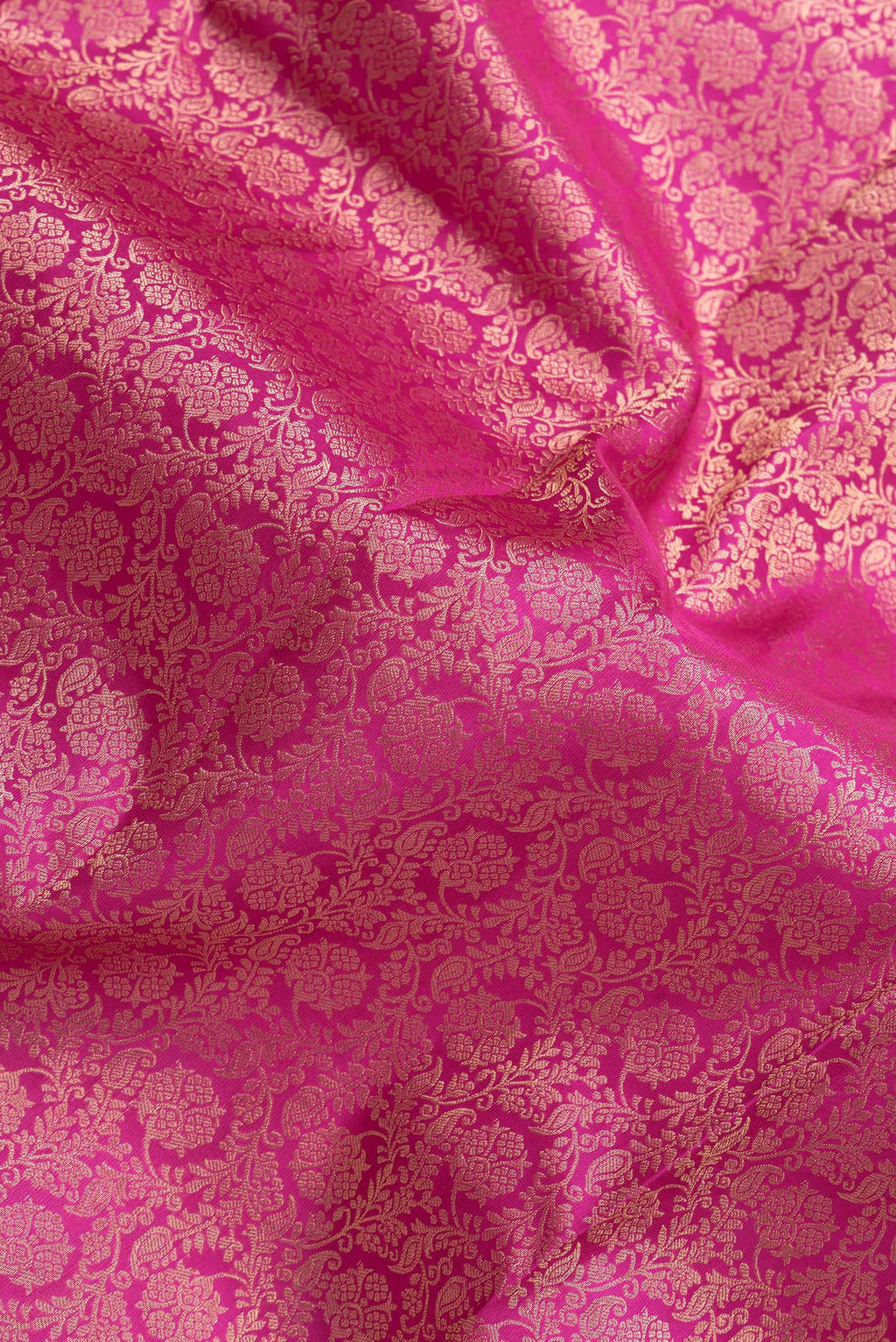 Close up of Pink Dual Tone Kanchipuram Silk Saree with Zari Brocade on the body and Zari Border.  displaying folds