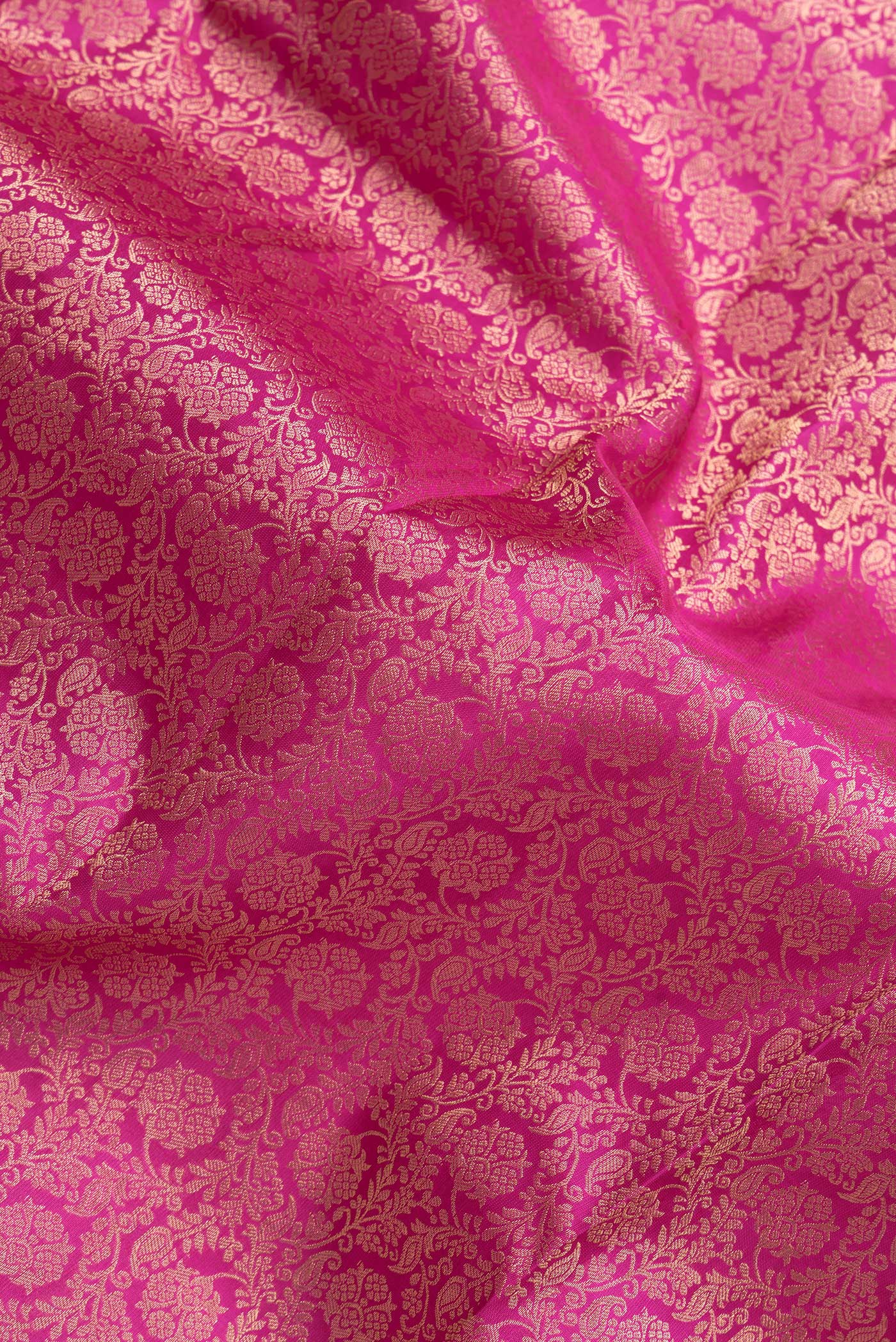 Close up of Pink Dual Tone Kanchipuram Silk Saree with Zari Brocade on the body and Zari Border.  displaying folds