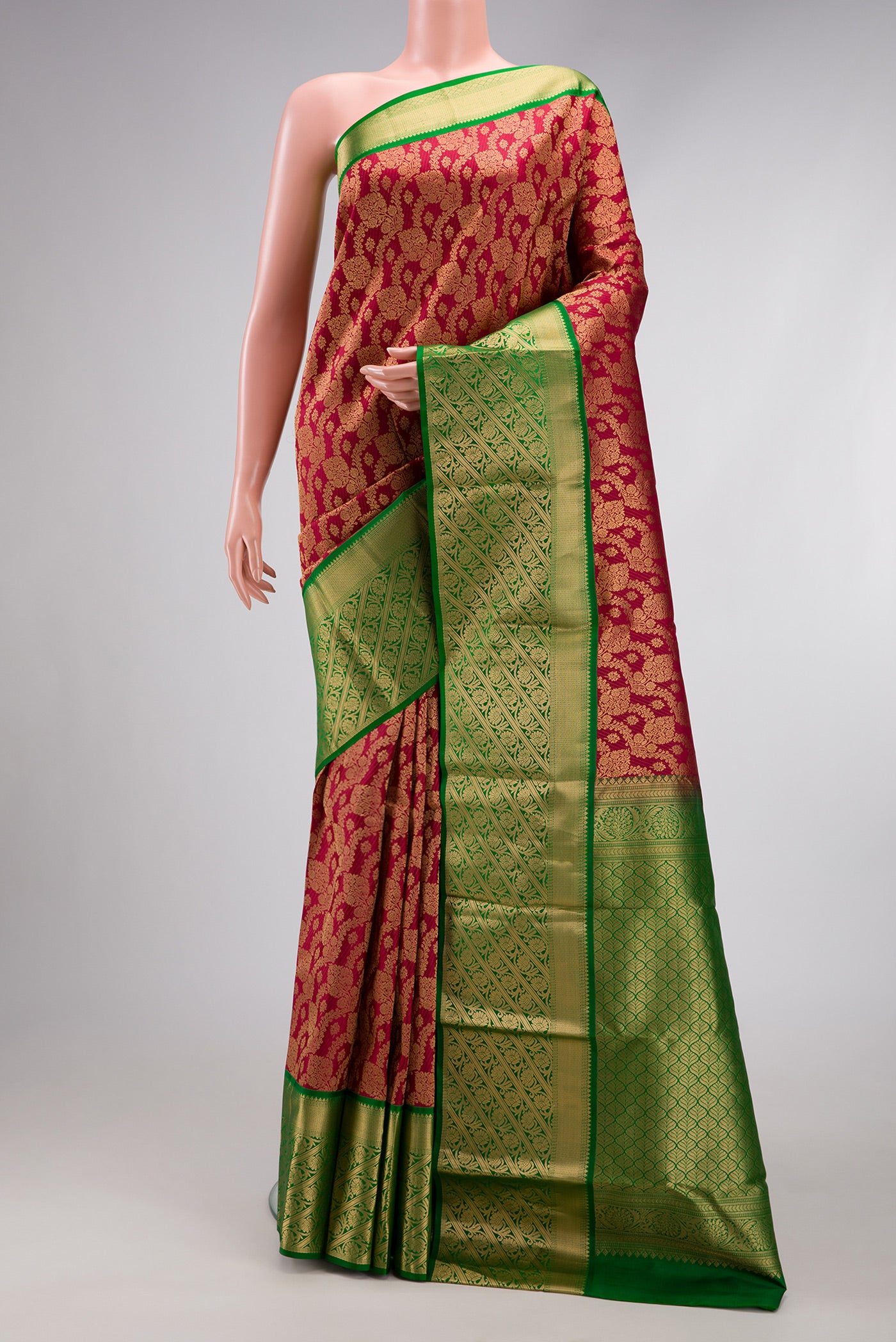 Maroon Kanchipuram Silk Saree with Zari Brocade on the body and Zari Border.  displayed on a mannequin