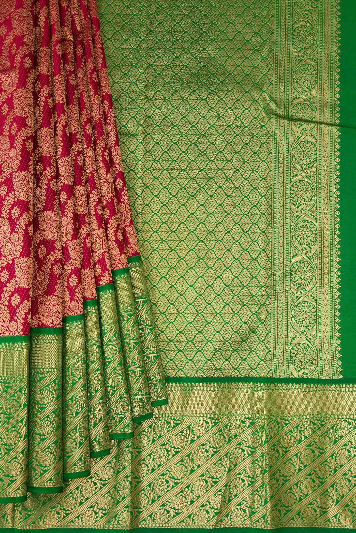 Pleats and pallu of Maroon Kanchipuram Silk Saree with Zari Brocade on the body and Zari Border. 