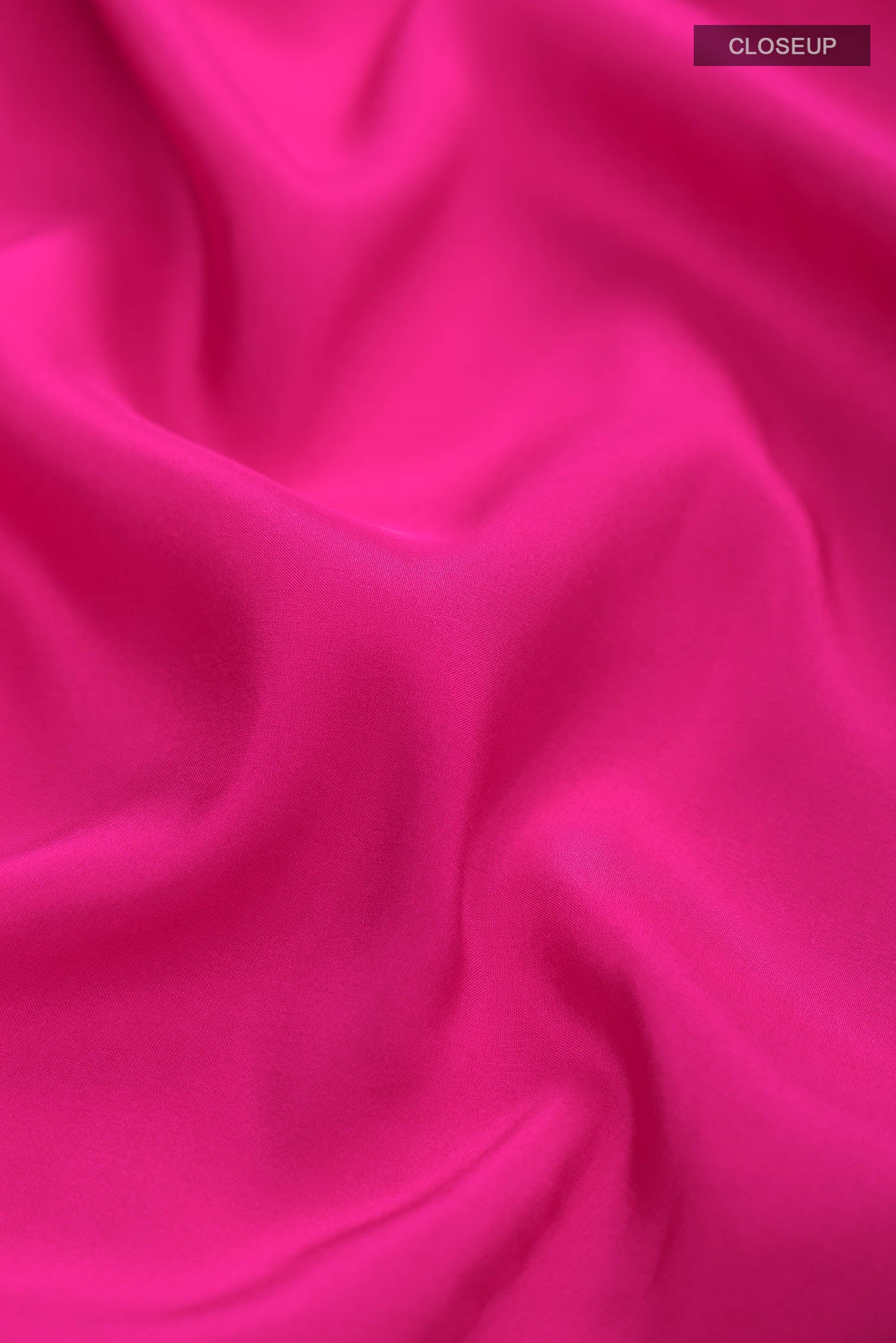 Close up of Pure Silk Pure Zari Pink Mysore Crepe Saree with Plain Body and Zari Border displaying folds