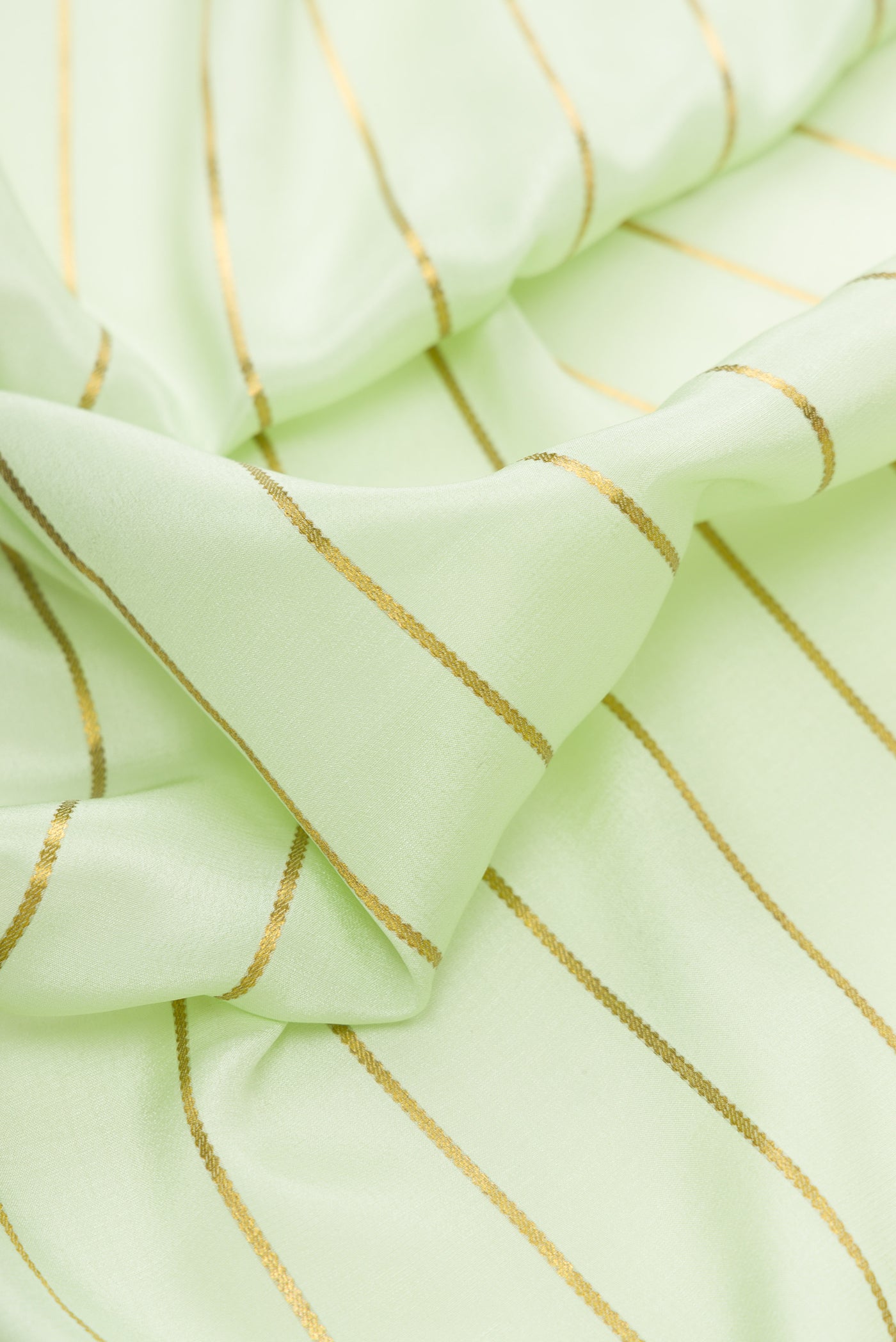 Close up of Pista Green Dual Tone Mysore Silk Saree with Stripes on the body and Fancy Border.  displaying folds