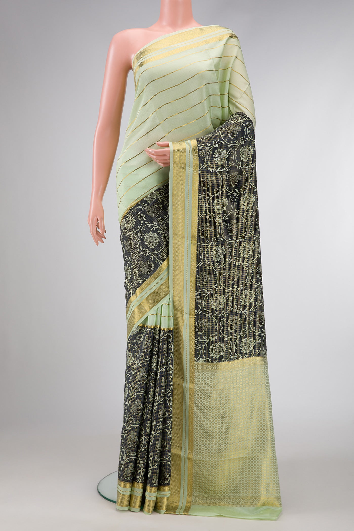 Pista Green Dual Tone Mysore Silk Saree with Stripes on the body and Fancy Border.  displayed on a mannequin