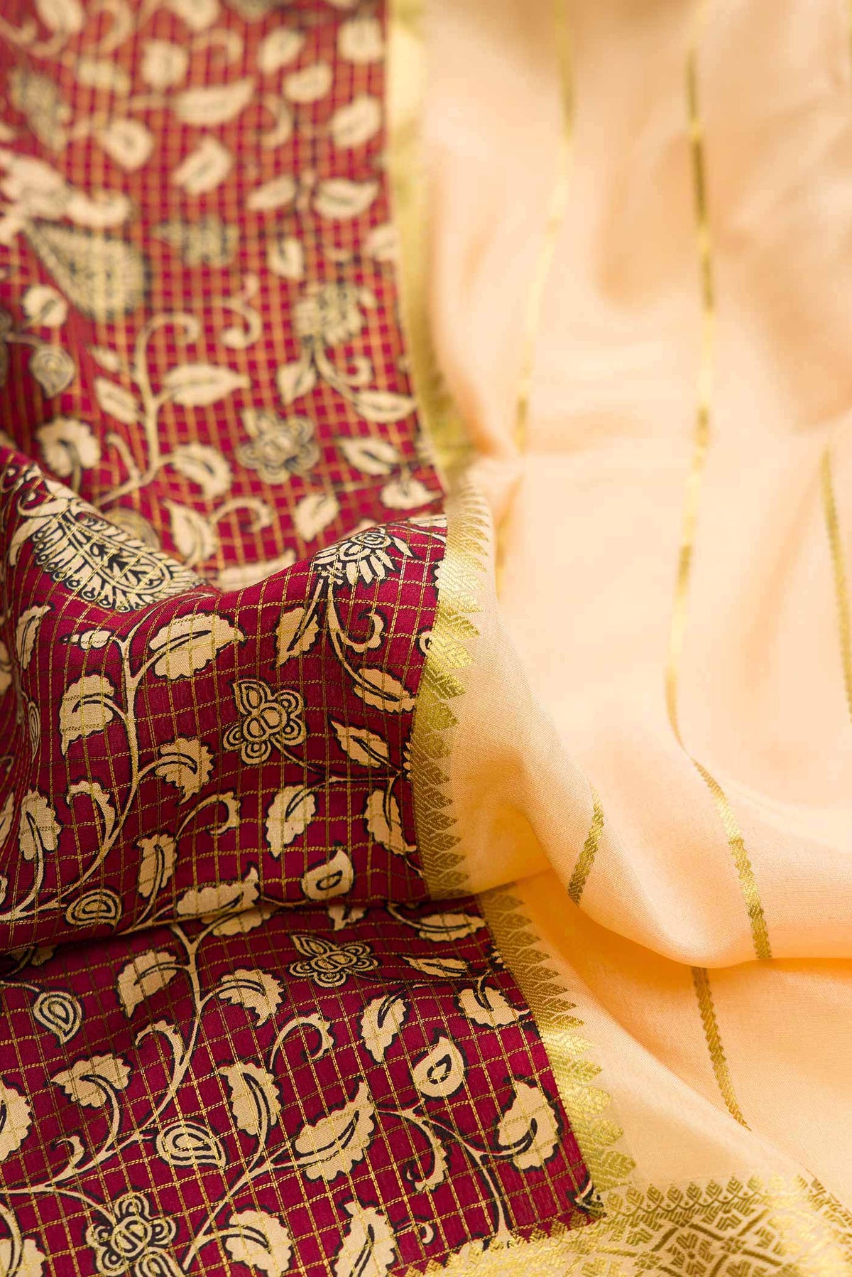 Close up of Sandal and Maroon Color Mysore Crepe Saree with Half And Half on the body and Zari Border displaying folds