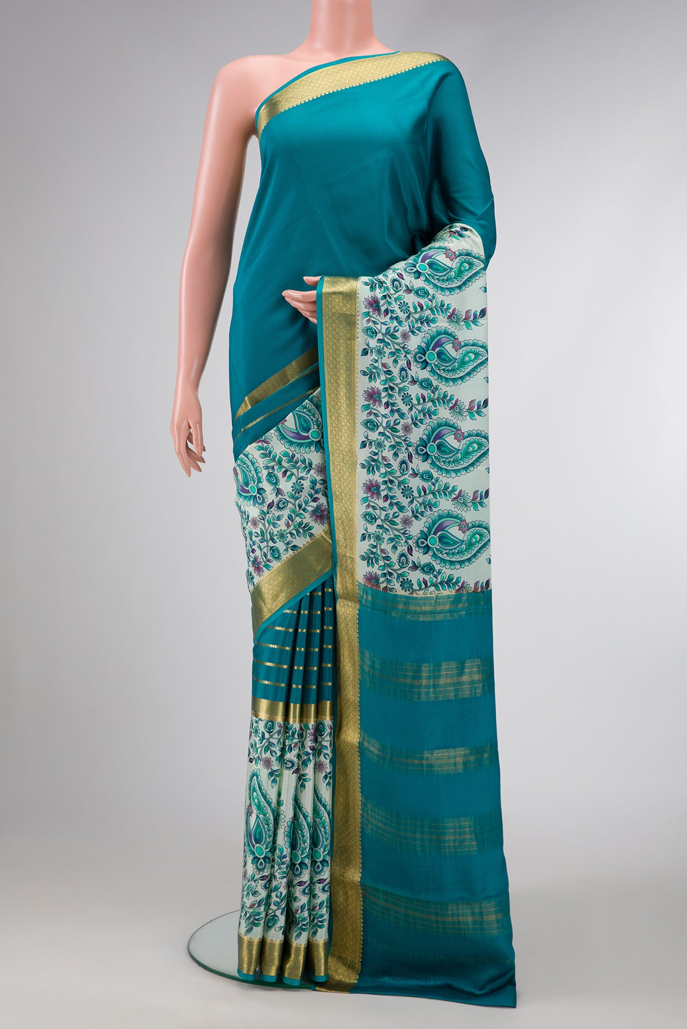 Peacock Blue Dual Tone Mysore Silk Saree with Stripes on the body and Fancy Border.  displayed on a mannequin