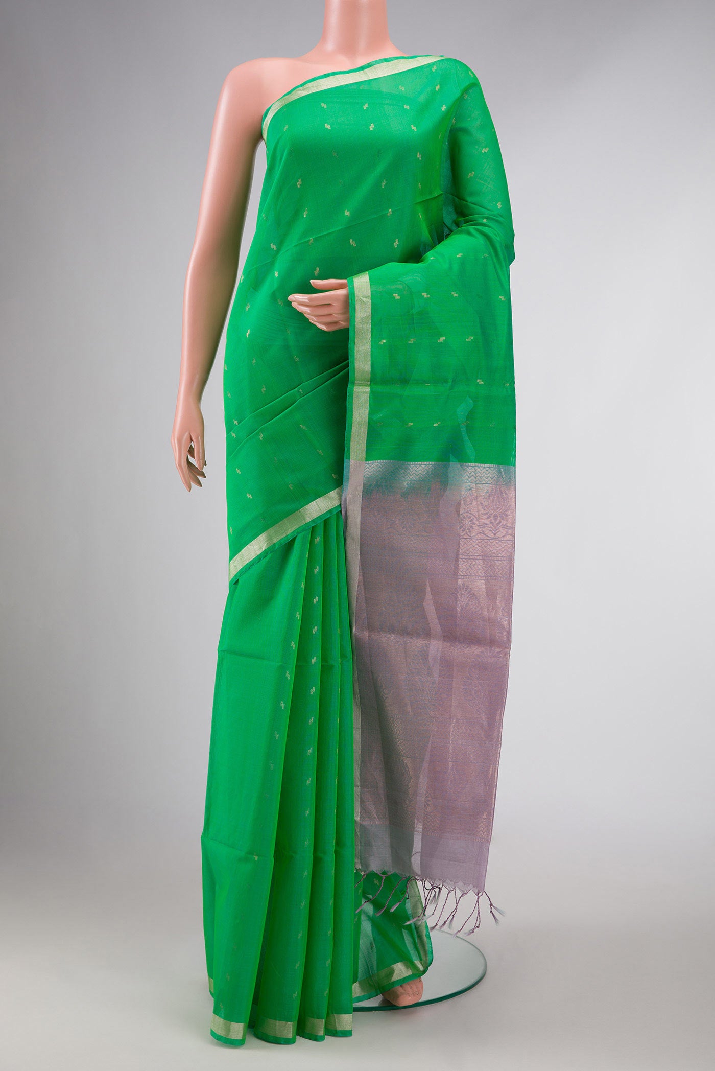 Parrot Green Dual Tone Silk Cotton Saree with Zari Butta on the body and Zari Border displayed on a mannequin