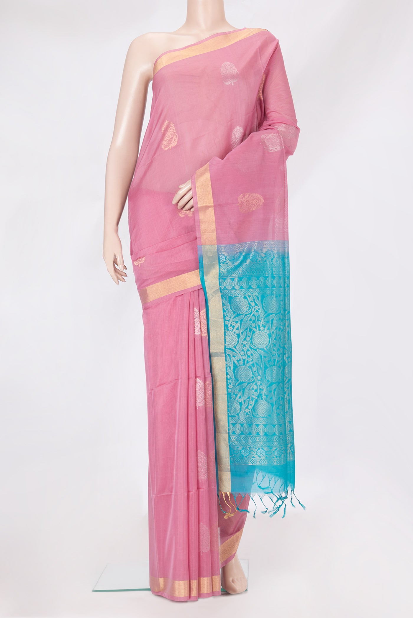 Pink Silk Cotton Saree with Zari Butta on the body and Zari Border.  displayed on a mannequin