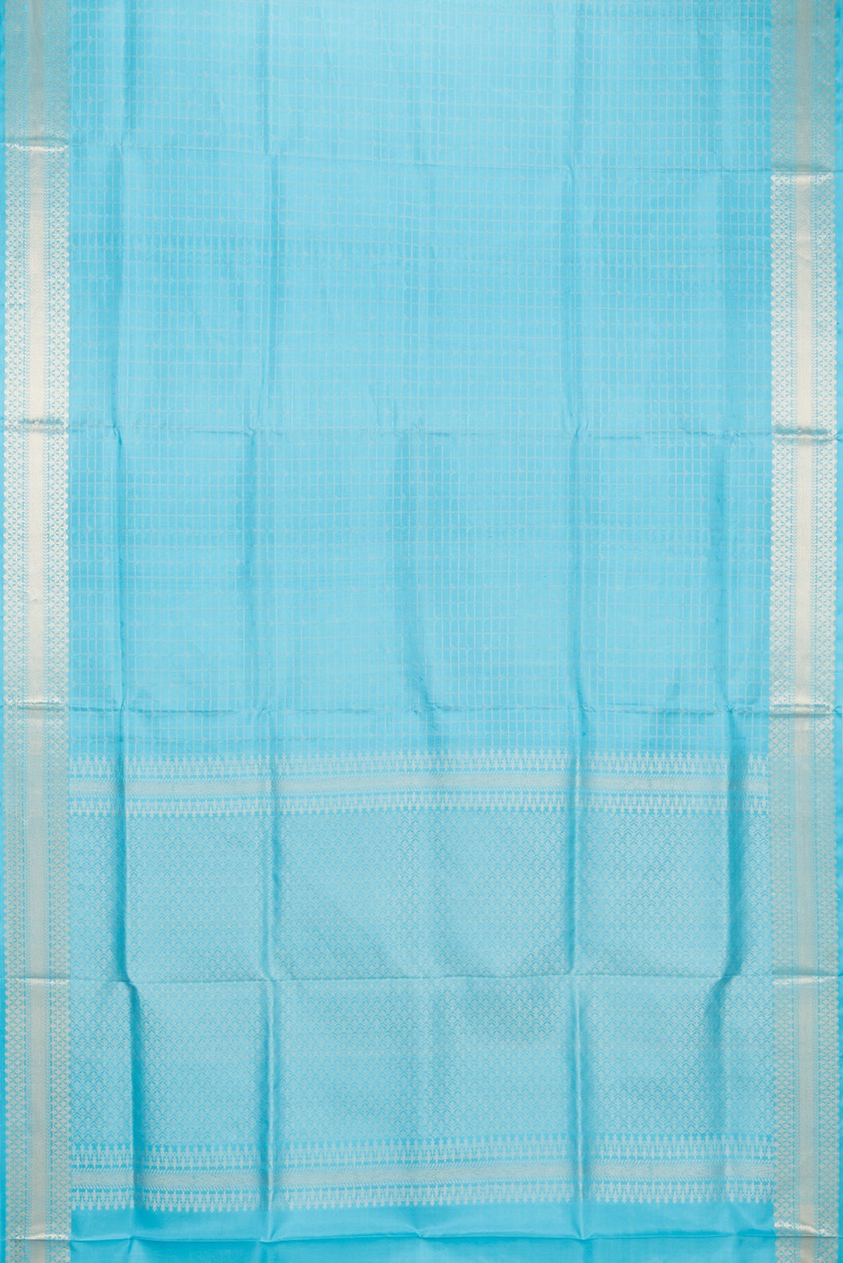 Flat view of Pure Silk Sky Blue Soft Saree with Checked design on the body and Zari Border. 