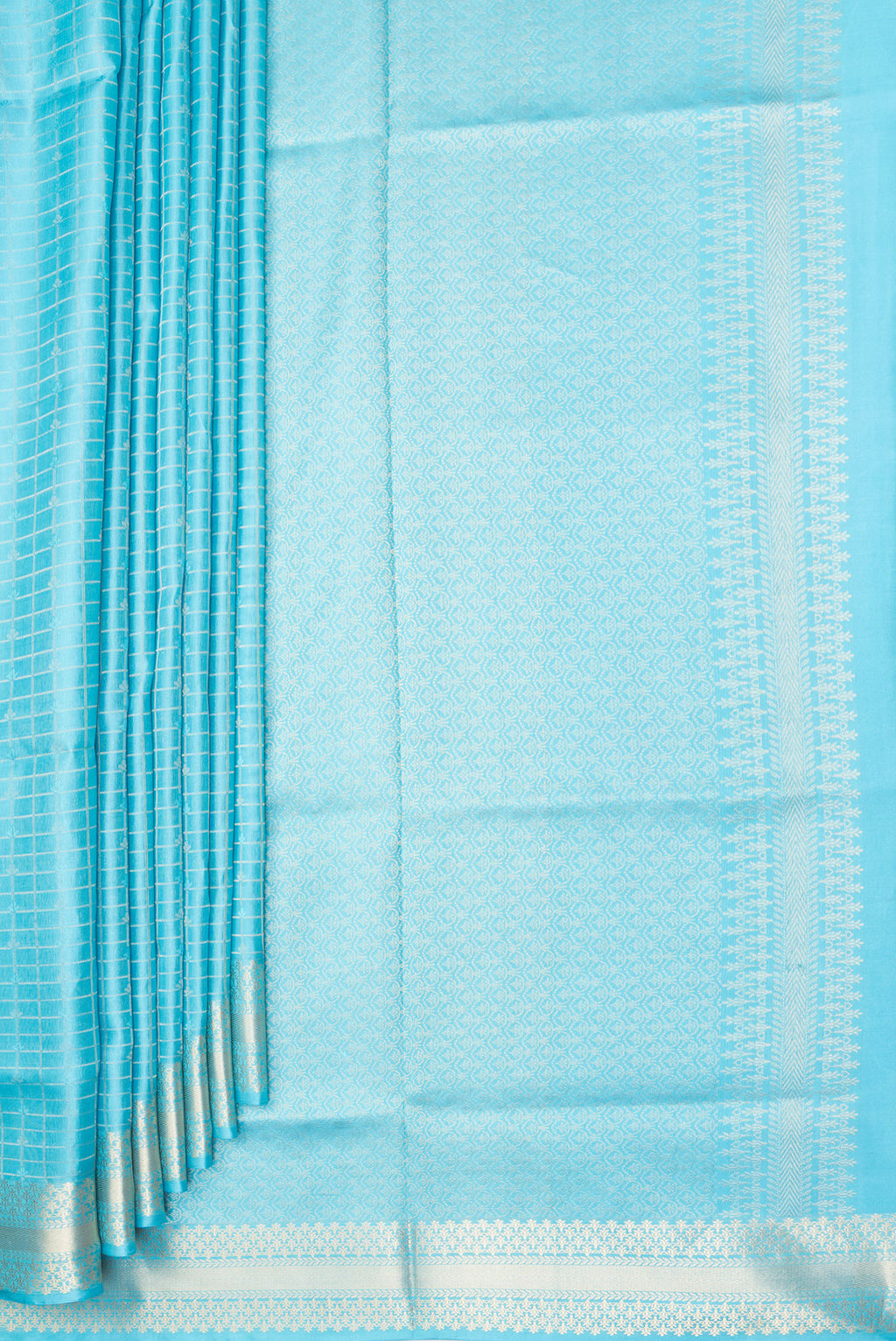 Pleats and pallu of Pure Silk Sky Blue Soft Saree with Checked design on the body and Zari Border. 