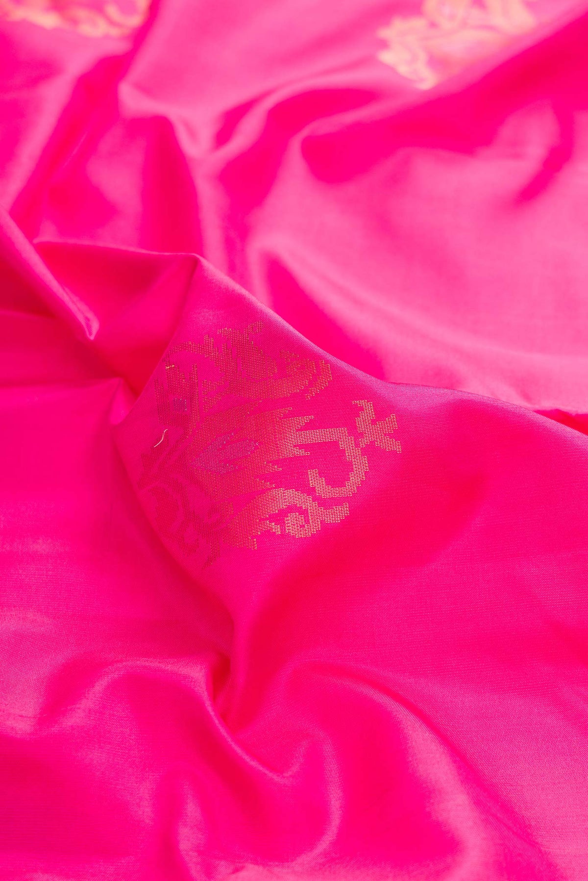 Close up of Pink Dual Tone Soft Silk Saree with Plain Body and Zari Border displaying folds