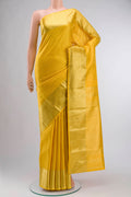 Yellow Kanchipuram Silk Saree with Stripes on the body and Zari Border displayed on a mannequin