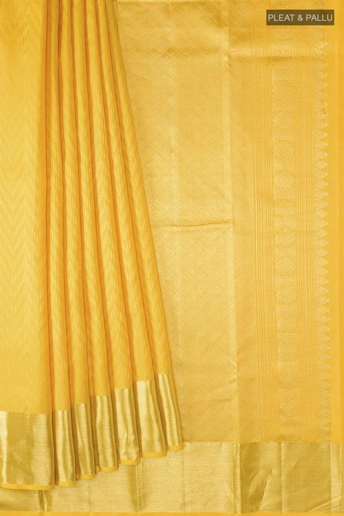 Pleats and pallu of Yellow Kanchipuram Silk Saree with Stripes on the body and Zari Border