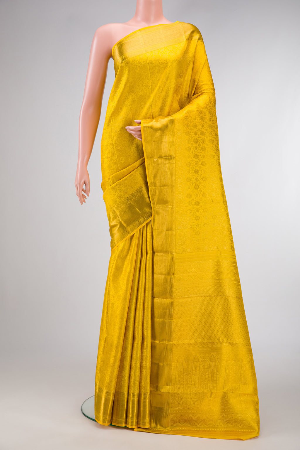 Yellow Dual Tone Kanjivaram Silk Saree with Zari Brocade on the body and Zari Border.  displayed on a mannequin