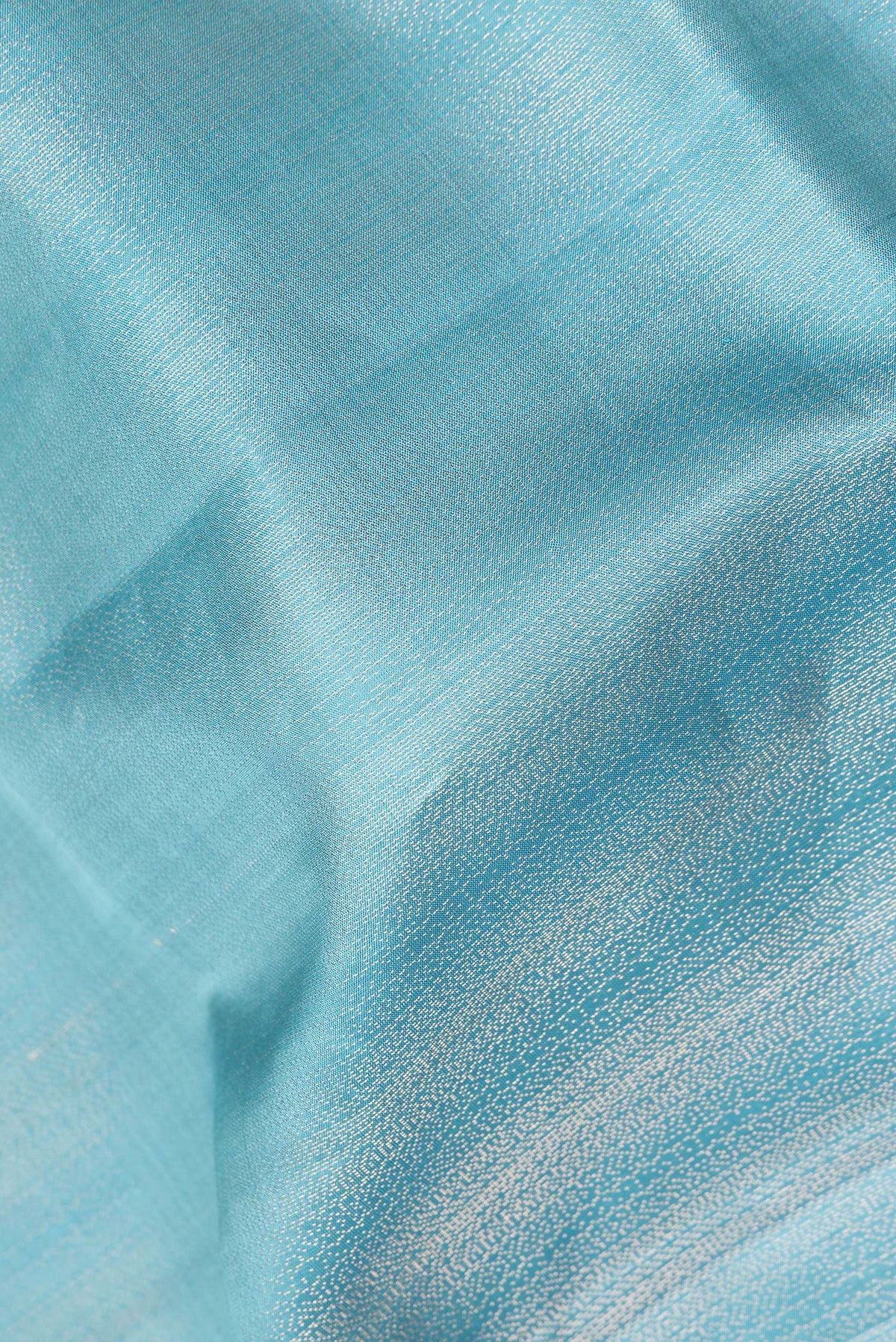 Close up of Pure Silk Sky Blue Soft Saree with Zari Brocade on the body and Zari Border.  displaying folds