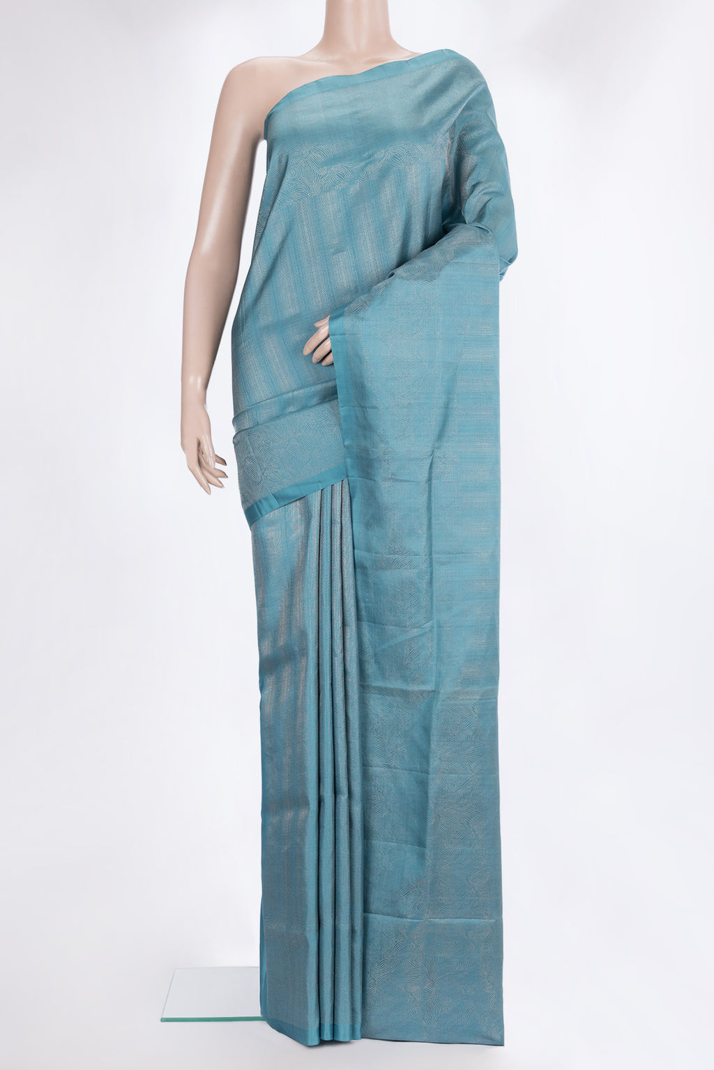 Pure Silk Sky Blue Soft Saree with Zari Brocade on the body and Zari Border.  displayed on a mannequin