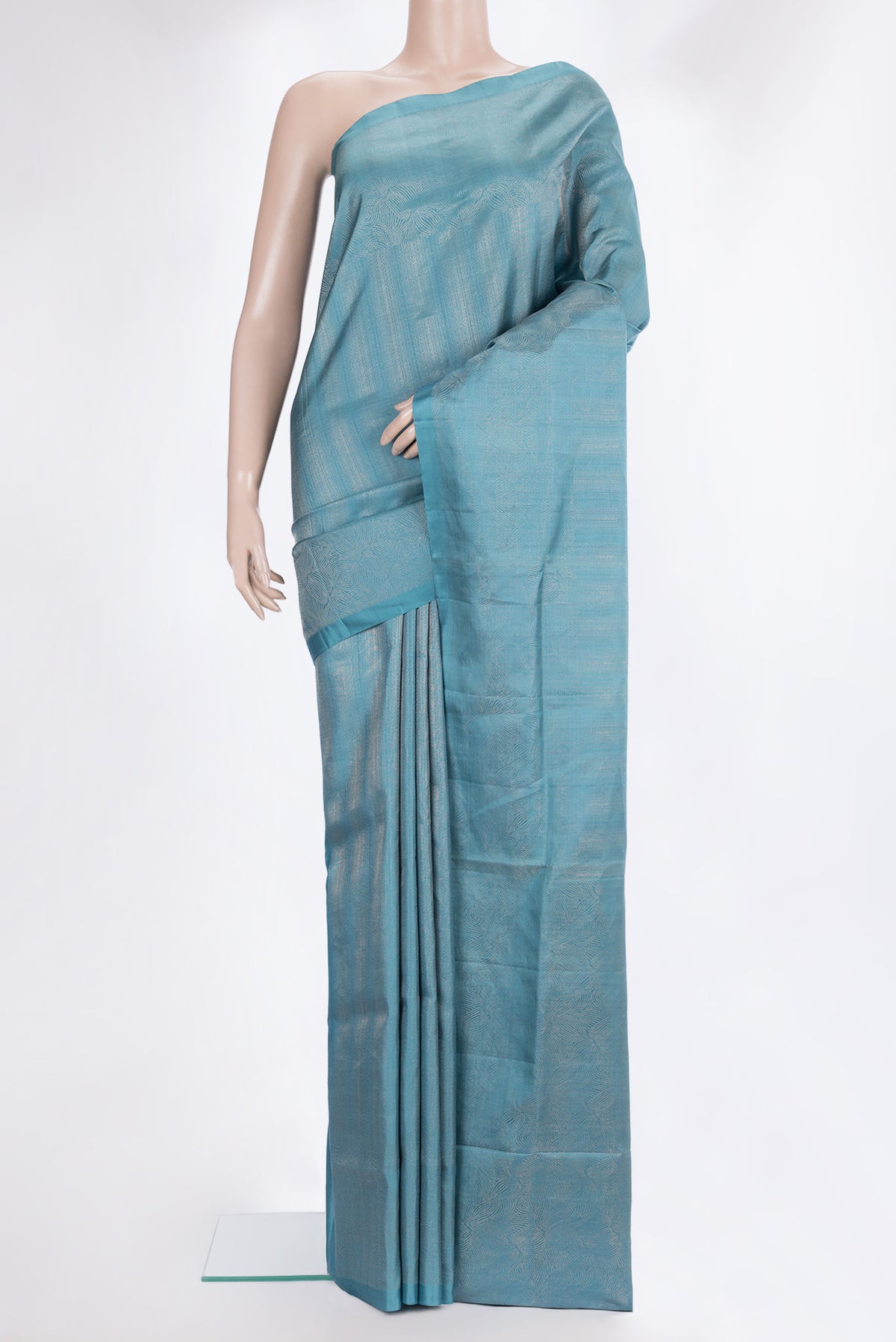 Pure Silk Sky Blue Soft Saree with Zari Brocade on the body and Zari Border.  displayed on a mannequin