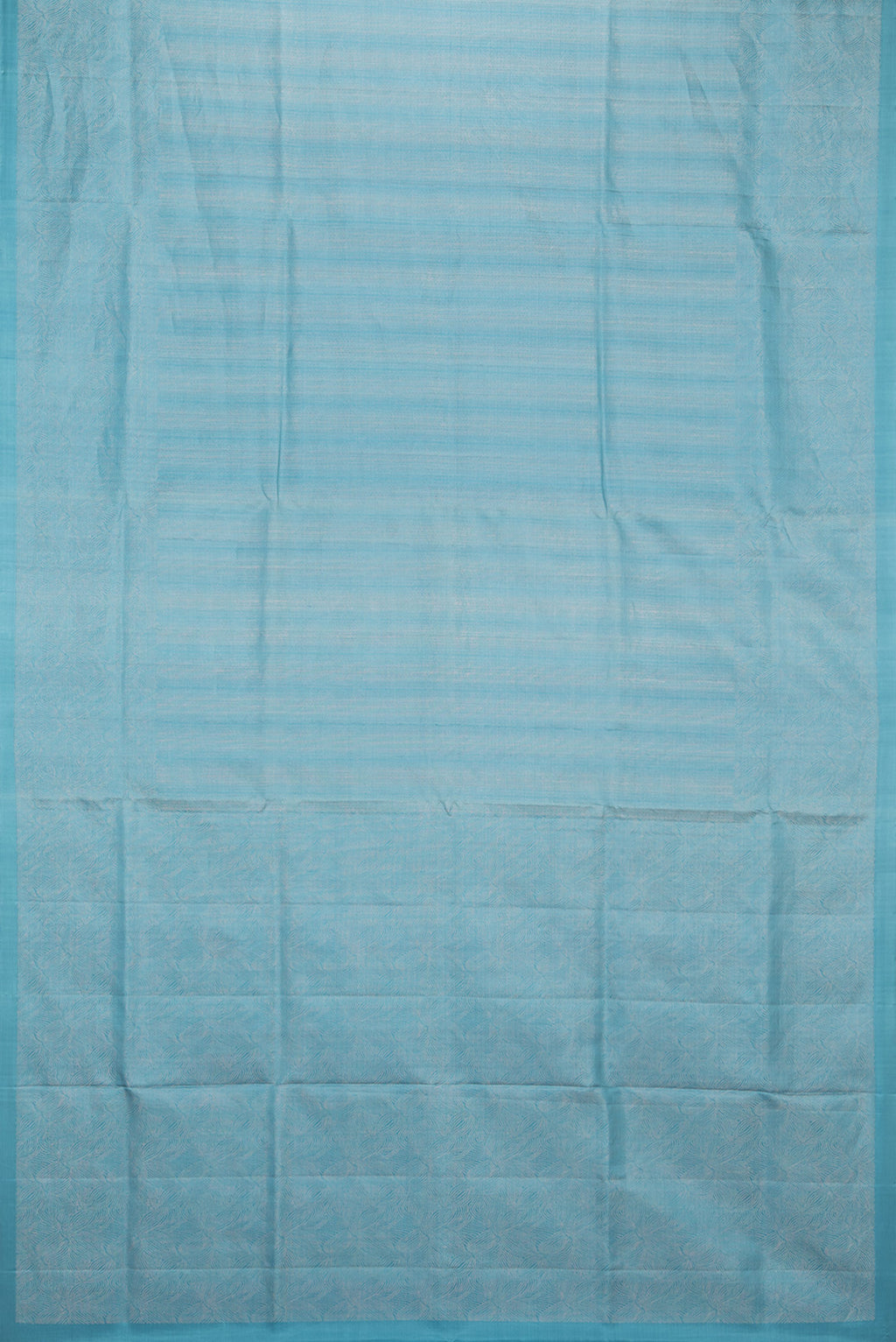 Flat view of Pure Silk Sky Blue Soft Saree with Zari Brocade on the body and Zari Border. 