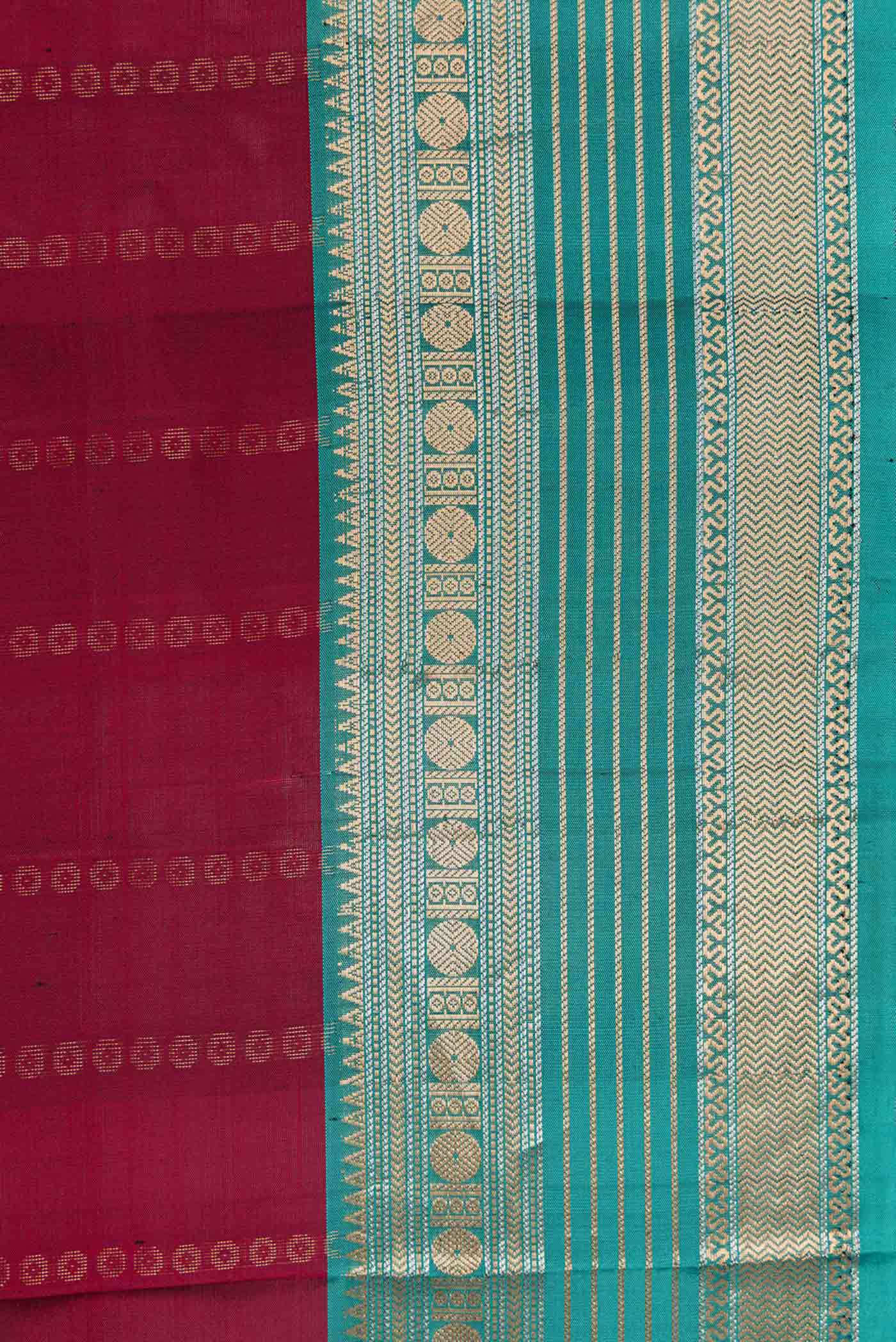 Border image of Maroon Dual Tone Kanjivaram Silk Saree with Stripes on the body and Zari Border. 