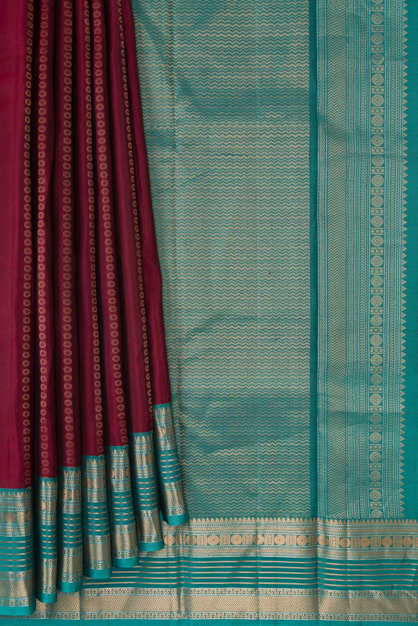 Pleats and pallu of Maroon Dual Tone Kanjivaram Silk Saree with Stripes on the body and Zari Border. 