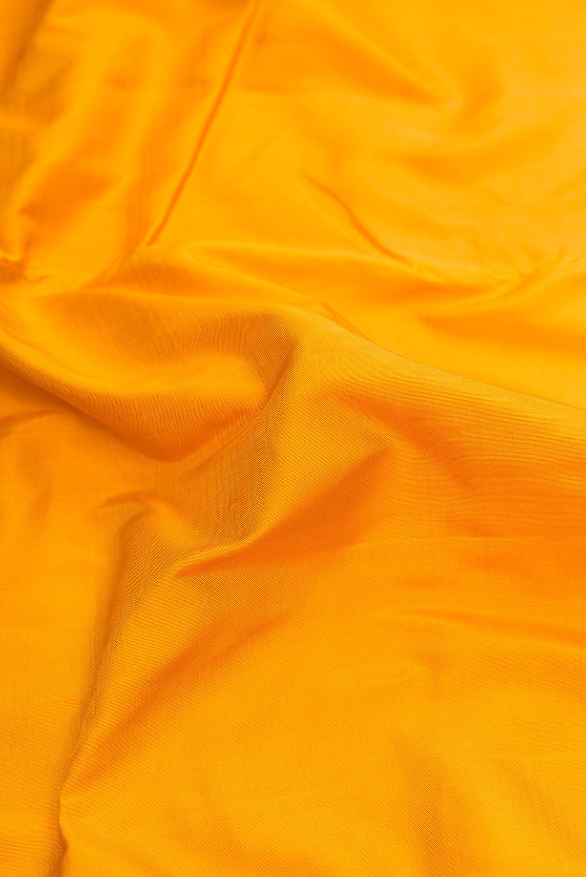 Close up of Mustard Dual Tone Kanjivaram Silk Nine Yards Saree with Stripes on the body and Zari Border.  displaying folds
