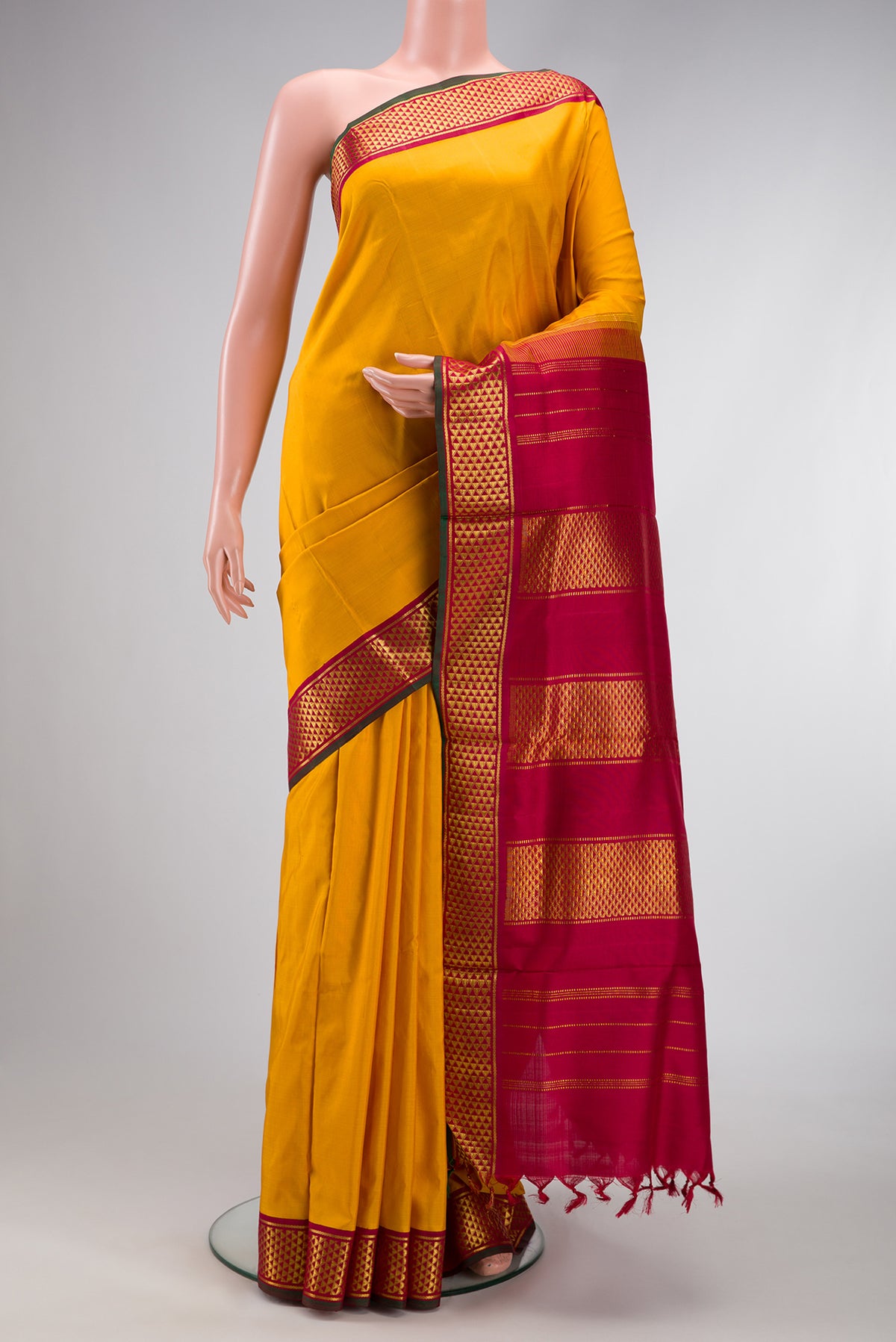 Mustard Dual Tone Kanjivaram Silk Nine Yards Saree with Stripes on the body and Zari Border.  displayed on a mannequin