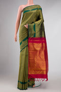 Green Dual Tone Kanchipuram Silk Saree with Zari Brocade on the body and Fancy Border displayed on a mannequin