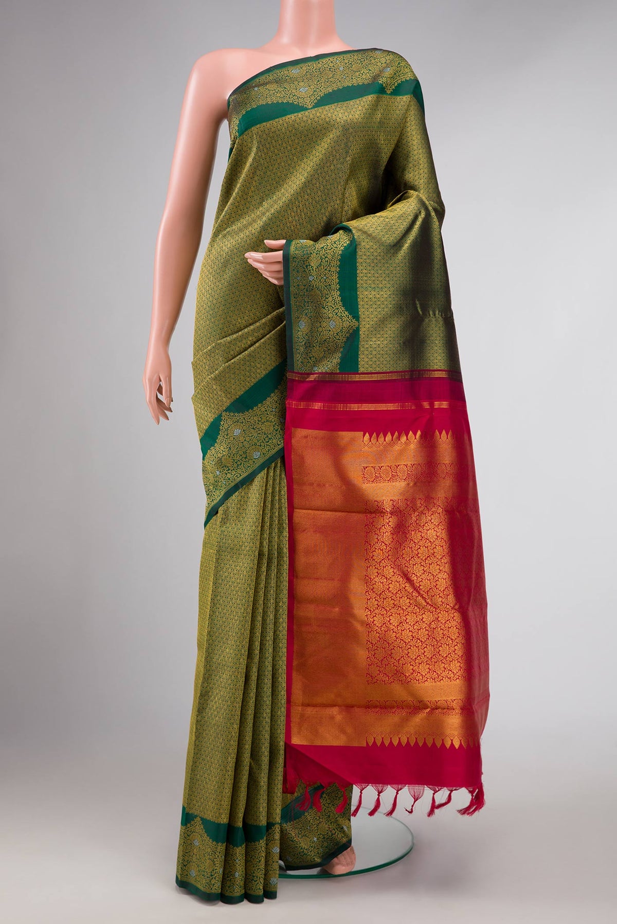 Green Dual Tone Kanchipuram Silk Saree with Zari Brocade on the body and Fancy Border displayed on a mannequin