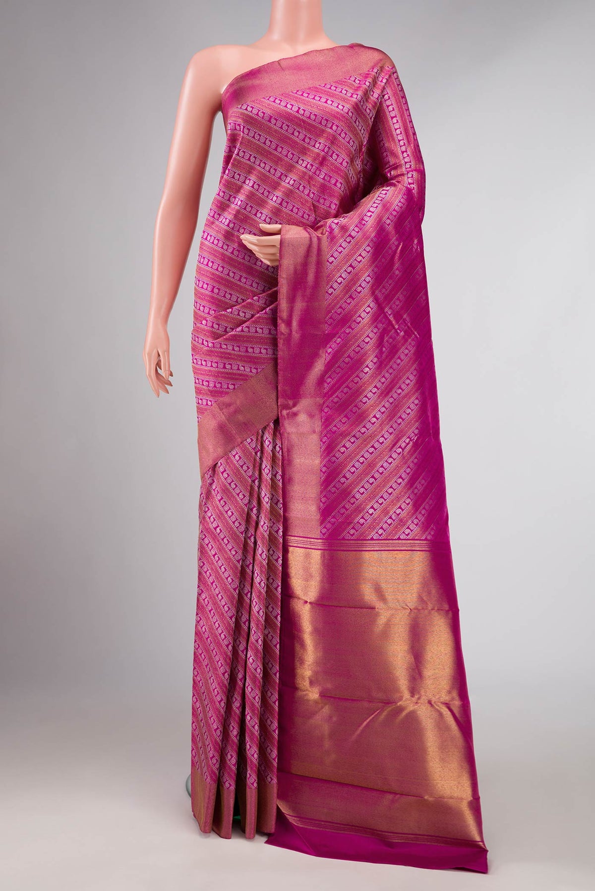 Pink Dual Tone Kanchipuram Silk Saree with Zari Brocade on the body and Zari Border displayed on a mannequin