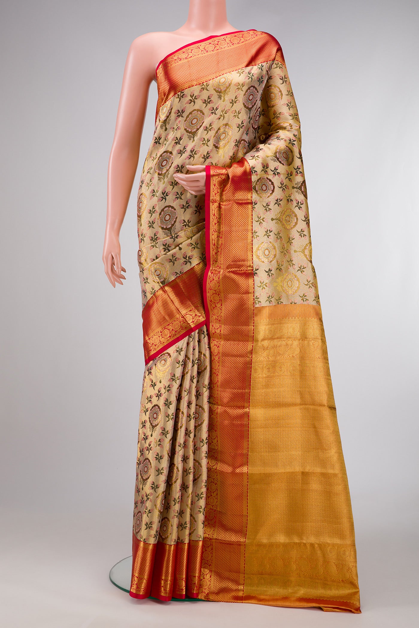 Gold Dual Tone Kanjivaram Tissue Silk Saree with Zari Brocade on the body and Zari Border.  displayed on a mannequin