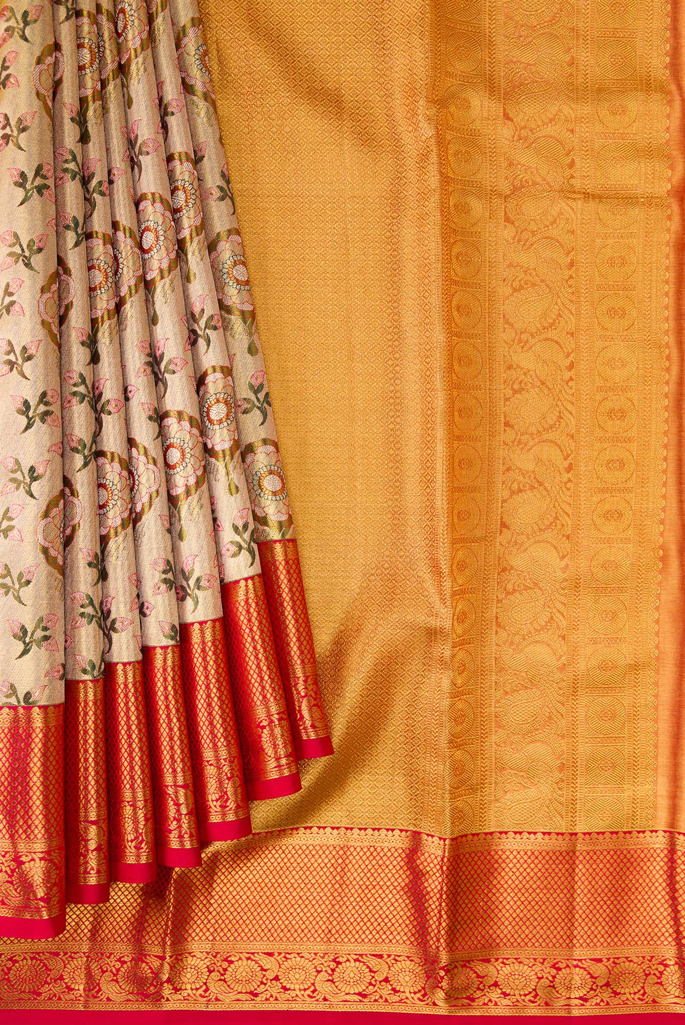 Pleats and pallu of Gold Dual Tone Kanjivaram Tissue Silk Saree with Zari Brocade on the body and Zari Border. 
