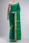 Green Mysore Crepe Saree with Plain Body and Zari Border displayed on a mannequin
