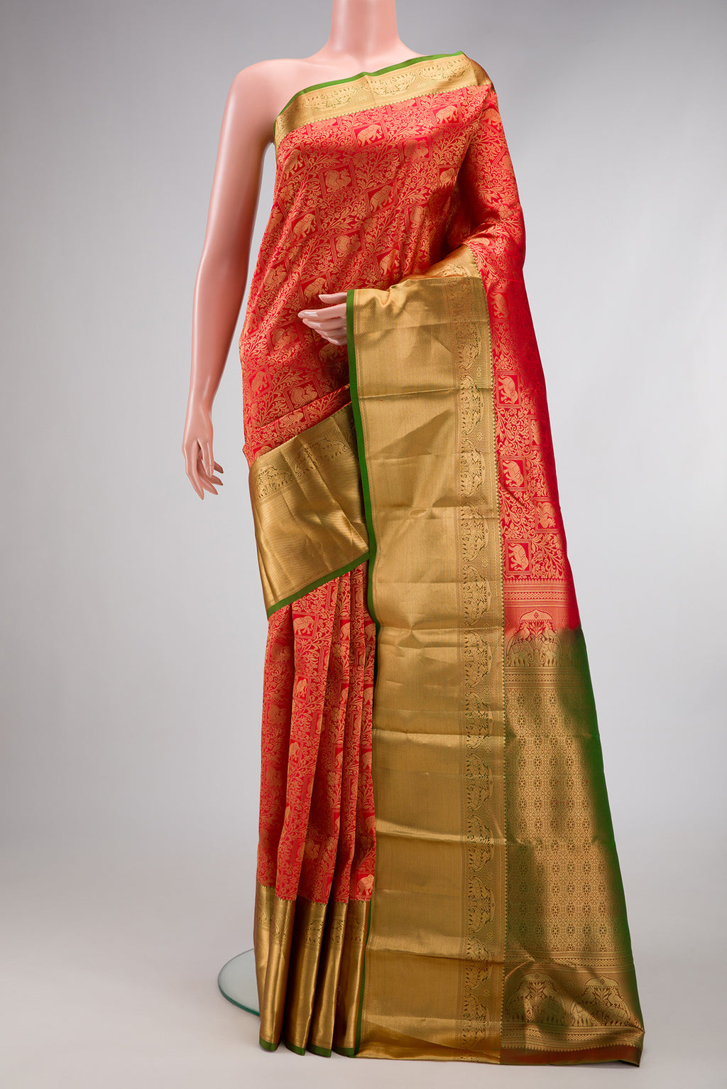 Red Kanchipuram Silk Saree with Zari Brocade on the body and Zari Border.  displayed on a mannequin