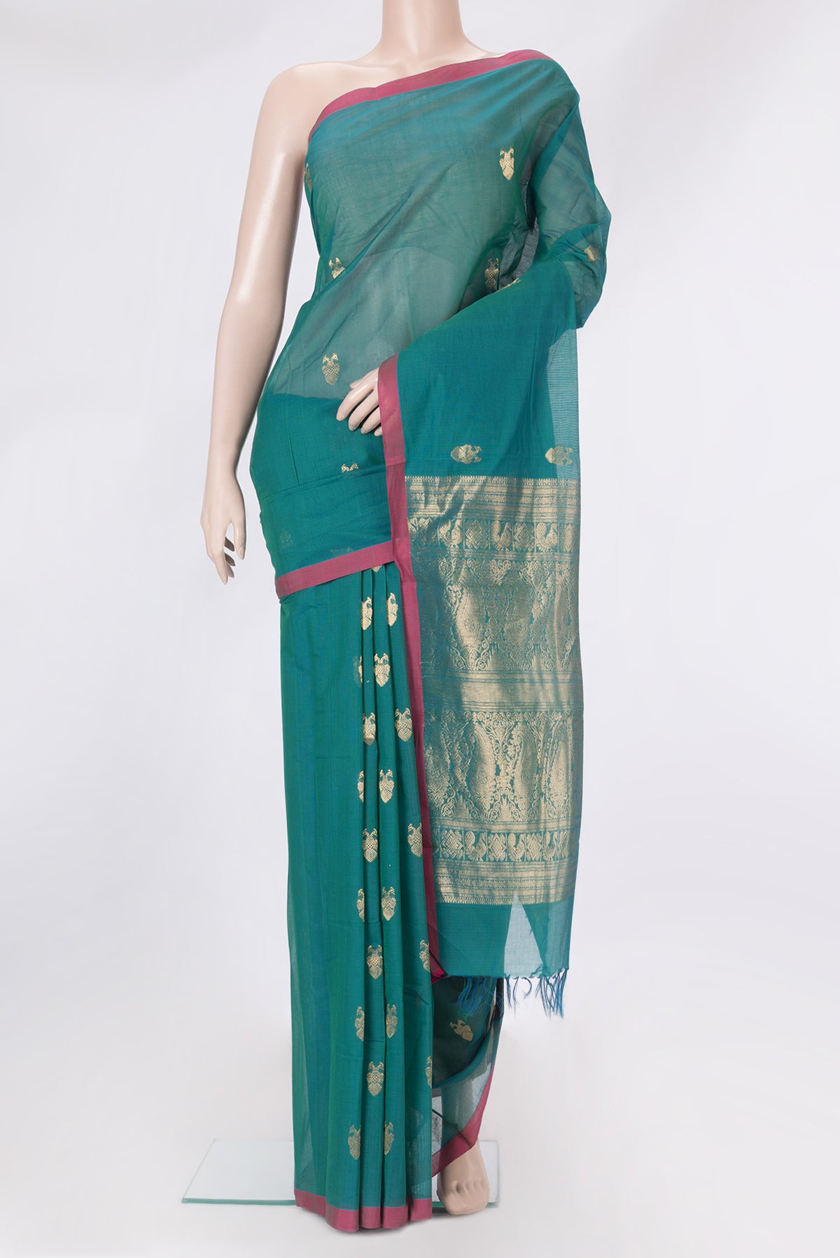 Peacock Blue Kanchi Cotton Saree with Zari Butta on the body and Plain Border.  displayed on a mannequin